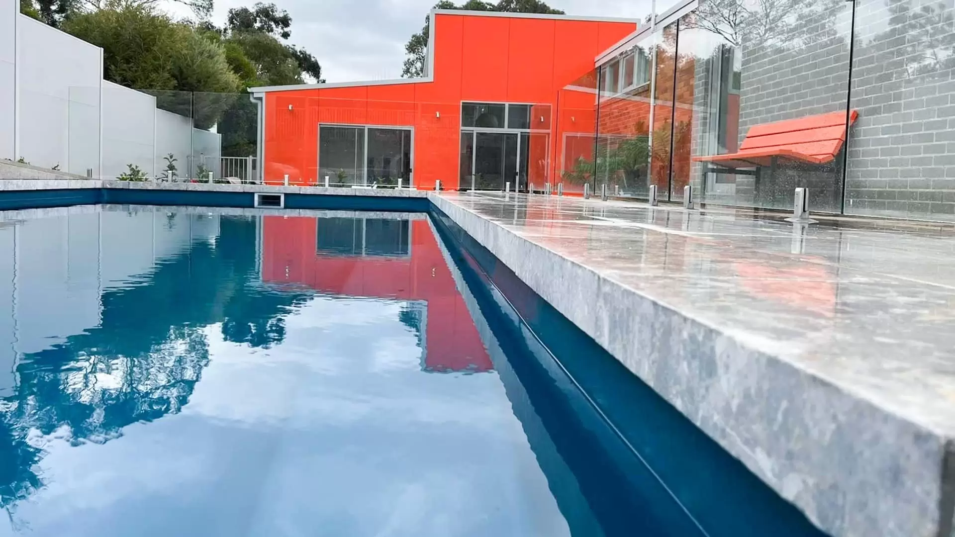 Pool installation with stone coping designed and built by In Depth in Canberra